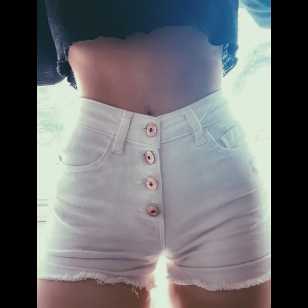 White shorts with gold button detailing